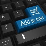Computer keyboard, ’’Add to cart’’ written across the Enter button