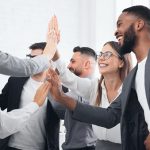 Team achievement, diverse business people giving high five at meeting