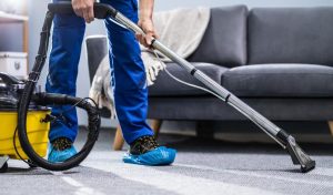 How does carpet cleaning differ from vacuuming